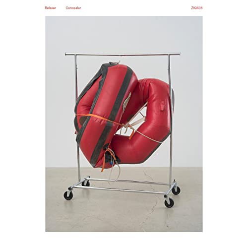 Red vinyl inflatable loungers on a metal clothing rack.