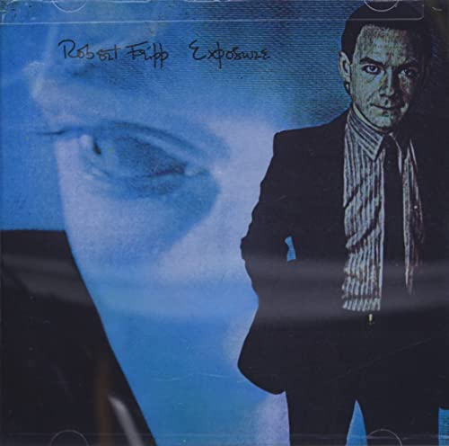 Album cover featuring Robert Fripp in a suit against a blue, ghostly face background.
