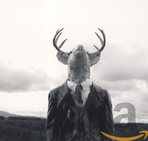 Black and white image of a deer-headed figure in a suit.