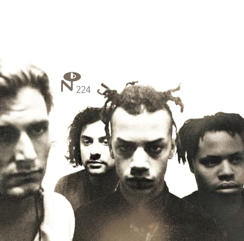 Black and white portrait of four young men with textured hair.