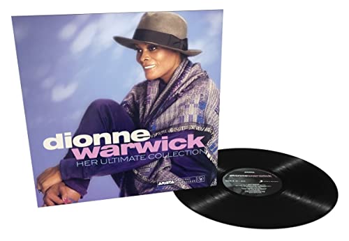 Dionne Warwick vinyl record and album cover with woman in hat and jacket.
