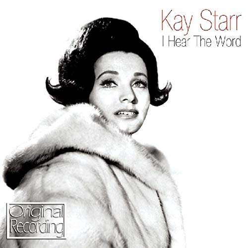 Black and white portrait of Kay Starr in a fur stole.