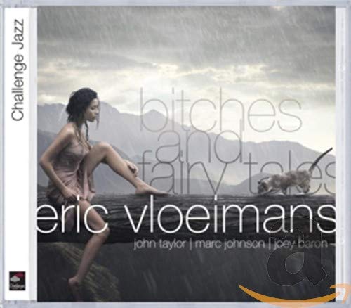 CD cover: woman seated on a log, misty mountains in background.