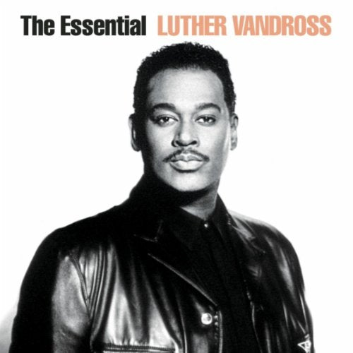 Black and white portrait of Luther Vandross wearing a leather jacket against white background.