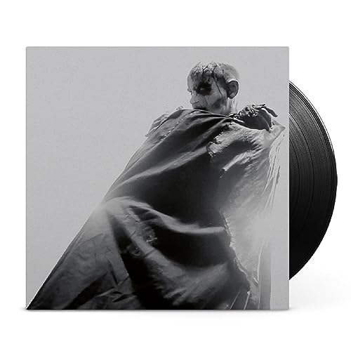 Black and white album cover with a figure and vinyl record side.
