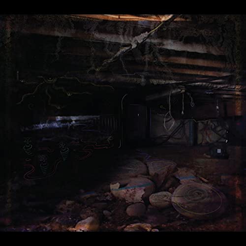 Dark, textured image of a crawlspace with glowing red lines and stones.