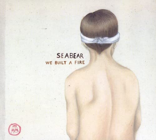 CD cover: back view of a person with a white headband.
