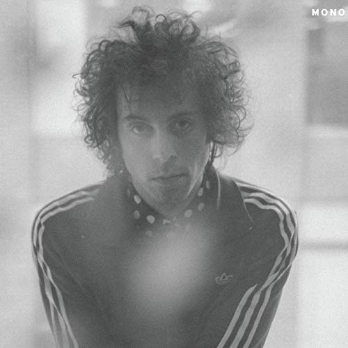 Black and white portrait of Daniel Romano with curly hair.