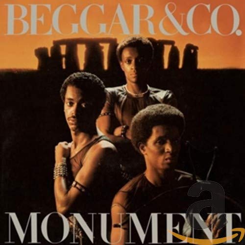 CD cover for Beggar & Co.'s "Monument" featuring three men and Stonehenge.