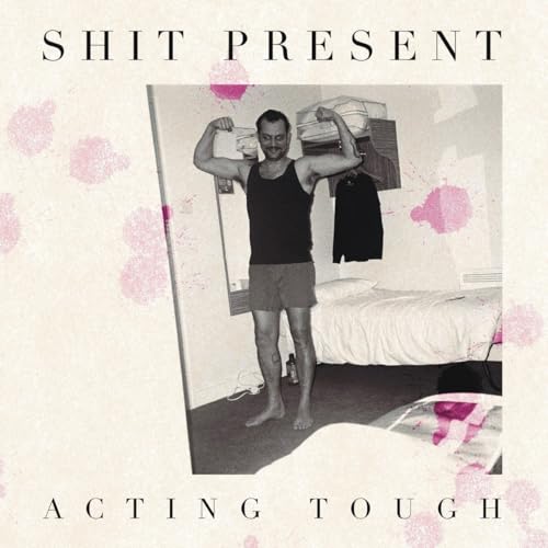 Vinyl record cover: man flexing in a bedroom, pink splatters.