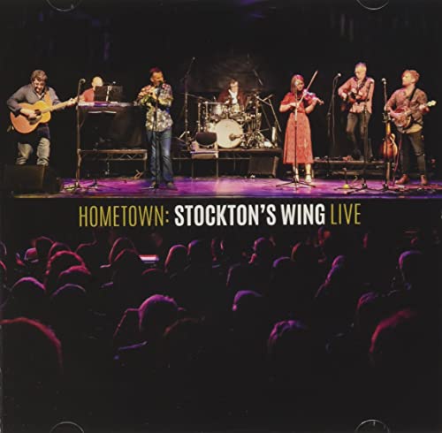 Stockton's Wing performing live on stage with a seated audience.
