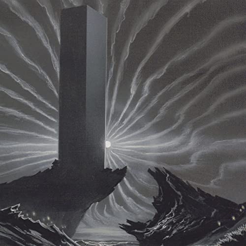 Monolithic black tower rises from jagged mountains under a swirling sky.