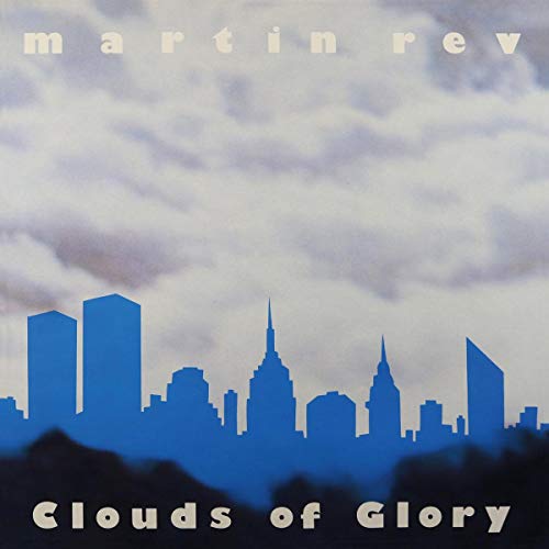 Album cover: blue cityscape silhouette against a cloudy, pale blue sky.
