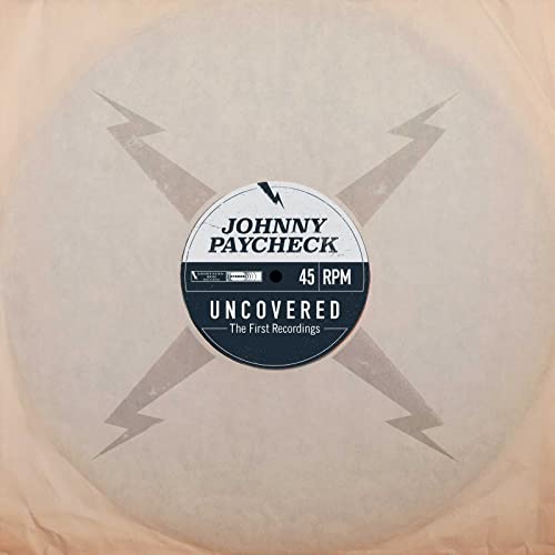 Clear vinyl record with "Johnny Paycheck - Uncovered" label and starburst design.