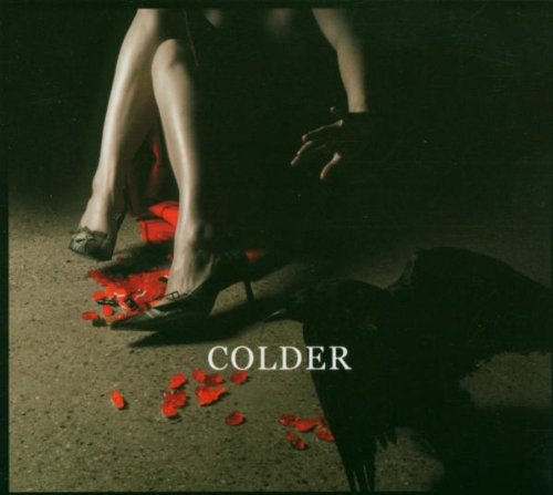 CD cover: woman in black dress among red rose petals.