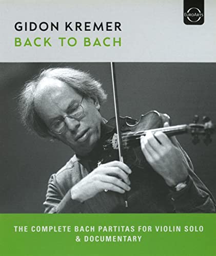 Gidon Kremer playing violin on Blu-ray cover for "Back To Bach.