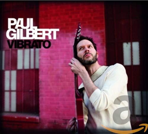 CD cover of Paul Gilbert's Vibrato featuring a man holding an electric guitar.