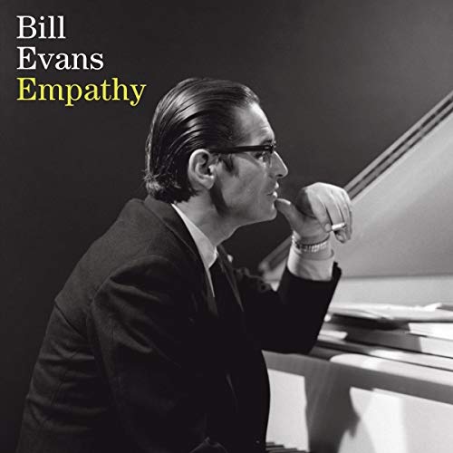 Black and white album cover of jazz pianist Bill Evans at a piano.