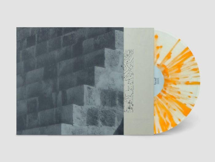 Vinyl record with orange and yellow swirls, and gray brick cover art.