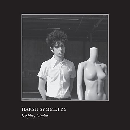 Black and white album cover featuring a man and mannequin.
