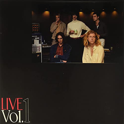 Five band members in a recording studio with the text LIVE Vol. 1 below.