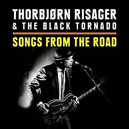 Thorbjørn Risager playing guitar on album cover, black and white photo.