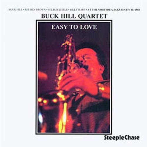 CD cover: jazz quartet with saxophone player in a dimly lit scene.