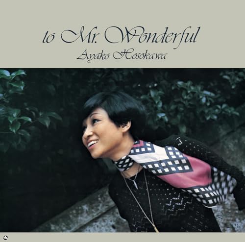 Ayako Hosokawa album cover, portrait of a smiling woman in patterned scarf.