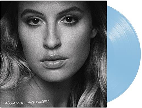 Black and white portrait of Fletcher with a light blue vinyl record.