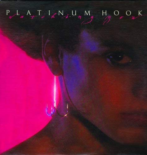 CD cover featuring a close-up of a person's face with a glowing earring.