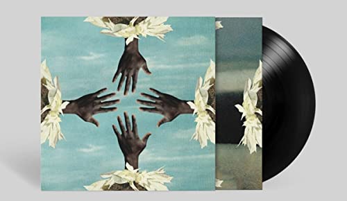 Kokoroko album cover with hands and flowers, next to a vinyl record.