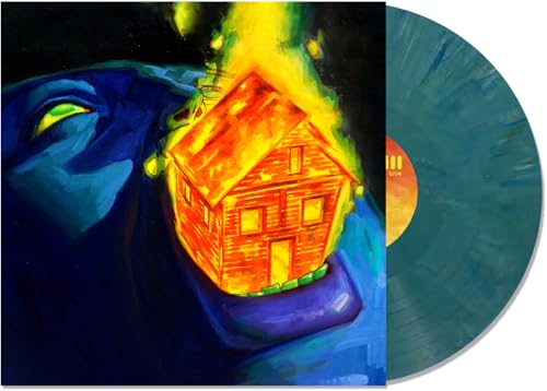 Vinyl record with album art of a burning house and blue face.