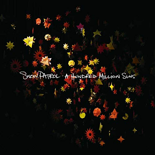 Album cover featuring colorful paper stars against a black background with white text overlay.