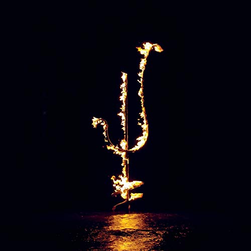 Fiery, abstract shape resembling a head against a dark background.