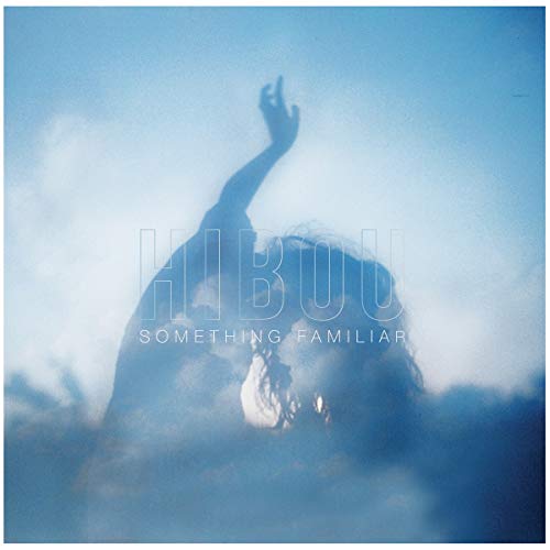 CD cover: blurry image of a person with raised arm in clouds.