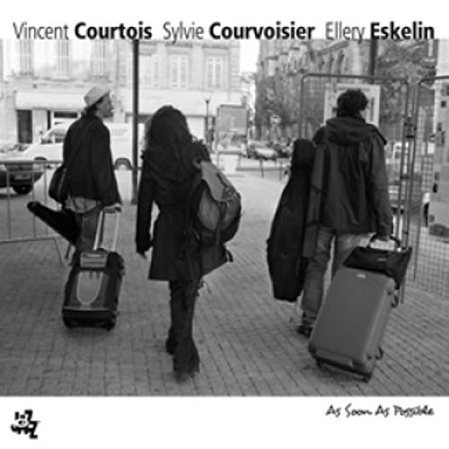 CD cover with black and white photo of three people with luggage.