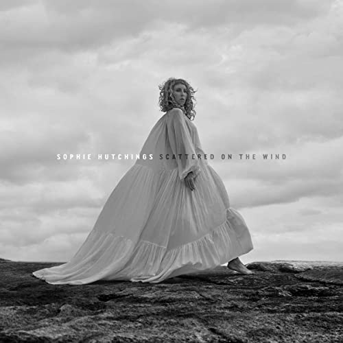 Black and white album cover featuring a woman in a flowing white dress.