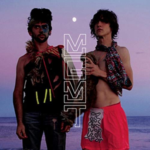 Two men in eccentric clothing stand on a beach at sunset with MGMT text overlay.