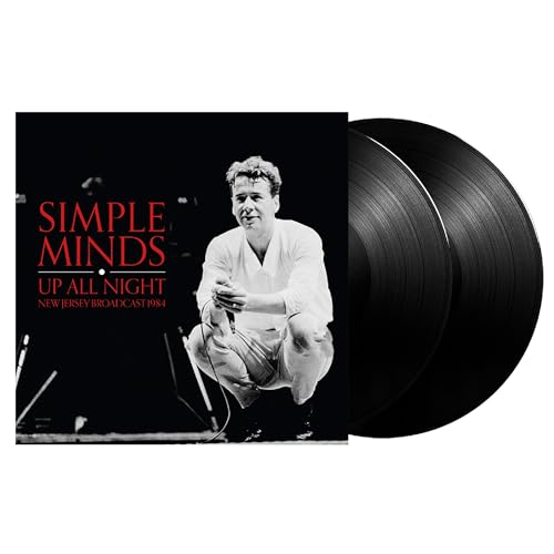 Simple Minds "Up All Night" vinyl record with a portrait of the singer.