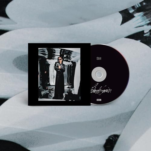 CD case and disc for Erika de Casier’s album “Still,” featuring a portrait.