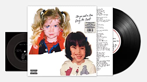 Vinyl record album cover featuring two children's portraits, handwritten text, and a black disc.