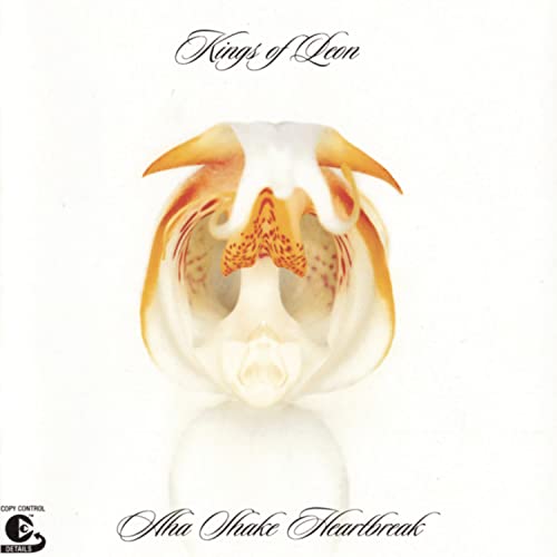Album cover featuring a white and orange orchid on a white background.