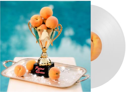 Gold trophy filled with peaches on a silver tray next to a clear vinyl.