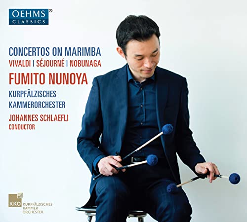 CD cover featuring marimba player Fumito Nunoya in a blue suit.
