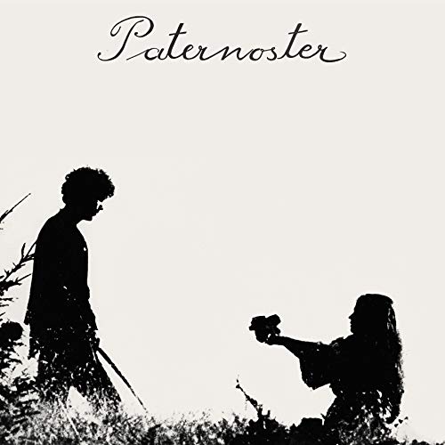 Black and white silhouette of a woman offering a flower to a standing man.