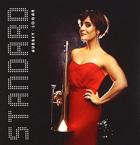 Aubrey Logan holds a trombone, wearing a red dress, against a black background.