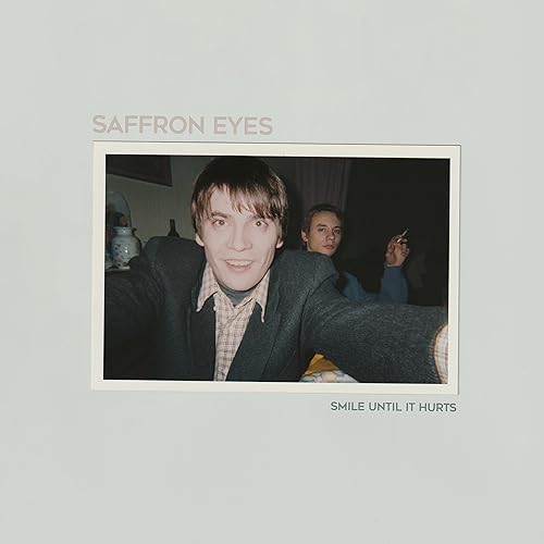 Vinyl album cover featuring a faded photo of two young men.