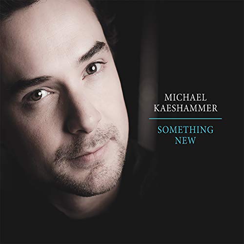 Close-up portrait of Michael Kaeshammer with album title "Something New".