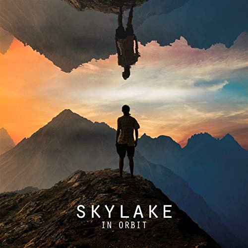 CD cover: person on mountain peak with mirrored figure above.
