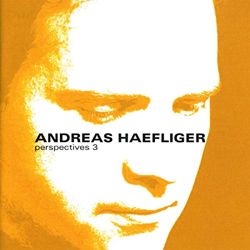 CD cover: close-up of a face in shades of orange and white.